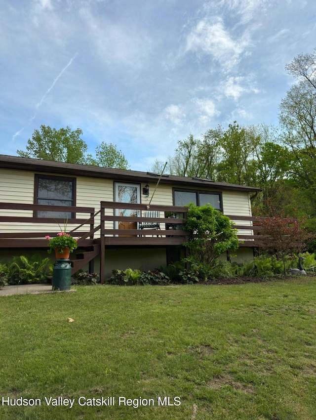 51 Patroon St, Claverack-Red Mills, NY 12513 - rear view of property featuring a wooden deck and a lawn