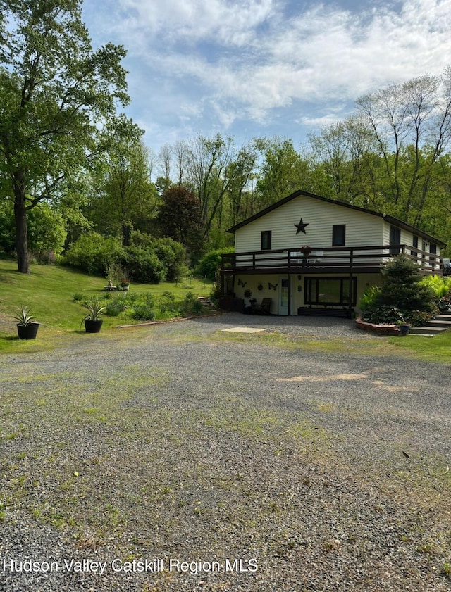 51 Patroon St, Claverack-Red Mills, NY 12513 - view of property's community featuring driveway, a deck, and a lawn