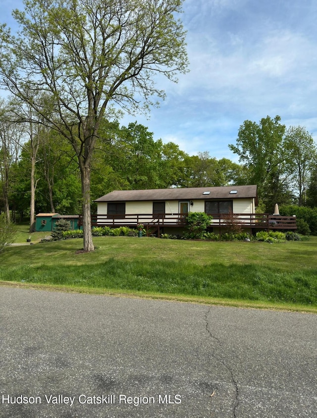 51 Patroon St, Claverack-Red Mills, NY 12513 - view of front of house featuring a wooden deck and a front yard