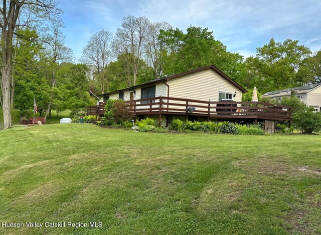 51 Patroon St, Claverack-Red Mills, NY 12513 - view of green lawn featuring a wooden deck and view of scattered trees