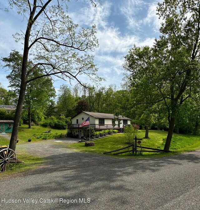 51 Patroon St, Claverack-Red Mills, NY 12513 - view of front of property featuring driveway, a front lawn, and a deck