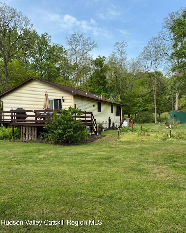 51 Patroon St, Claverack-Red Mills, NY 12513 - back of house with a wooden deck and a lawn