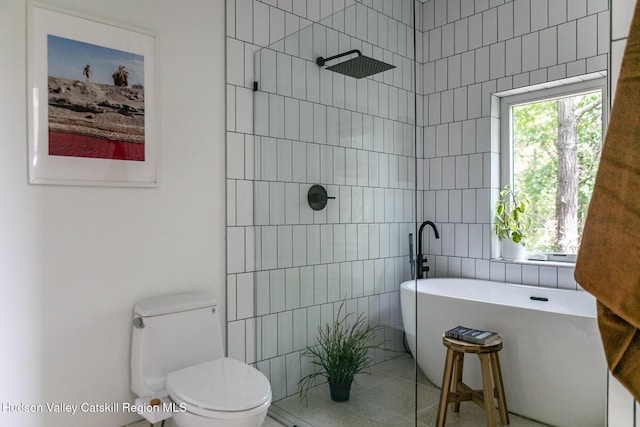 22 Skinner Ln, Catskill, NY 12414 - bathroom with a freestanding tub, tiled shower, and tile walls
