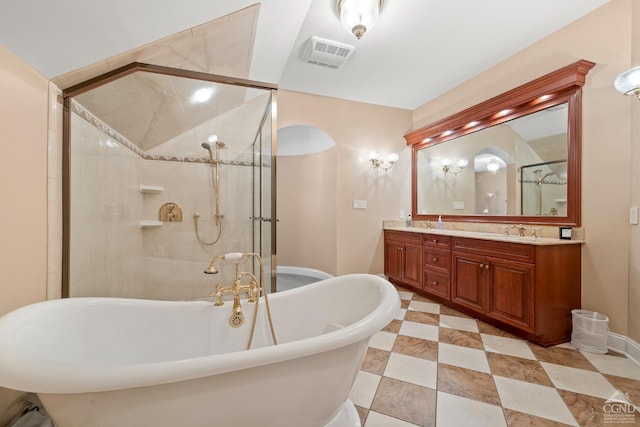 full bathroom featuring a stall shower, a soaking tub, and double vanity