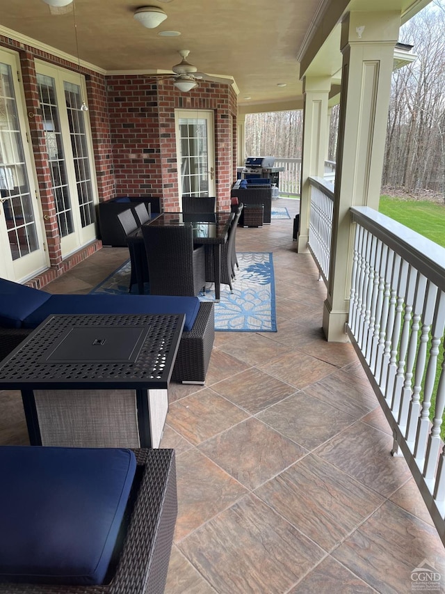 view of patio with ceiling fan and outdoor dining area
