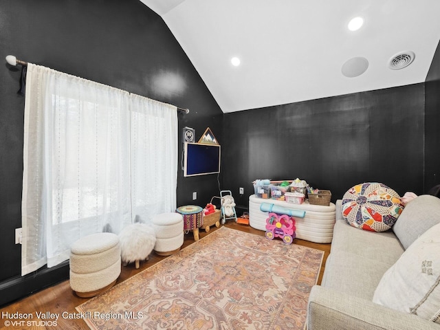 playroom with visible vents, vaulted ceiling, wood finished floors, and recessed lighting