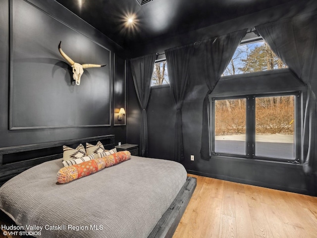 bedroom featuring hardwood / wood-style flooring