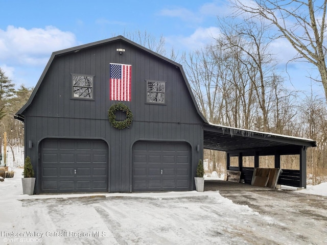 snow covered garage with a garage