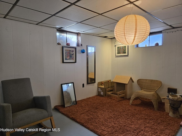 sitting room with a paneled ceiling