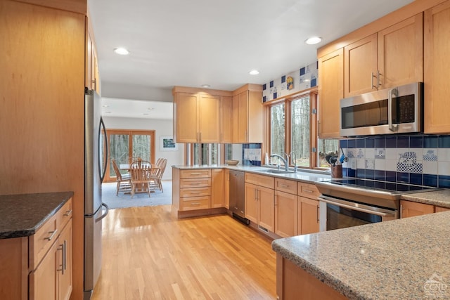 57 Spencer Rd, Austerlitz, NY 12017 - kitchen with stainless steel appliances, a sink, plenty of natural light, light wood-style flooring, and recessed lighting
