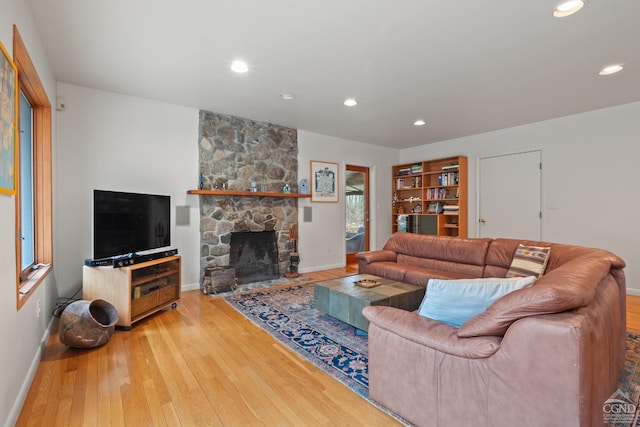 57 Spencer Rd, Austerlitz, NY 12017 - living room featuring baseboards, hardwood / wood-style flooring, a fireplace, and recessed lighting