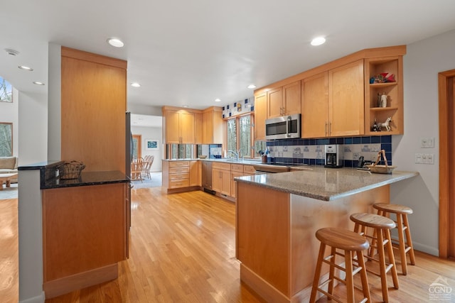 57 Spencer Rd, Austerlitz, NY 12017 - kitchen with appliances with stainless steel finishes, a peninsula, open shelves, dark stone countertops, and recessed lighting