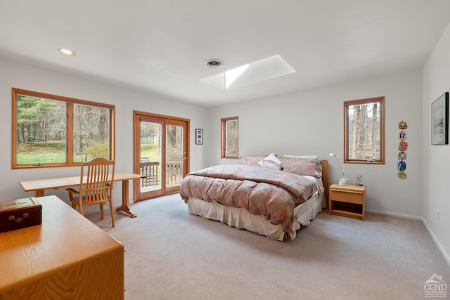 57 Spencer Rd, Austerlitz, NY 12017 - bedroom featuring a skylight, access to exterior, light carpet, baseboards, and recessed lighting