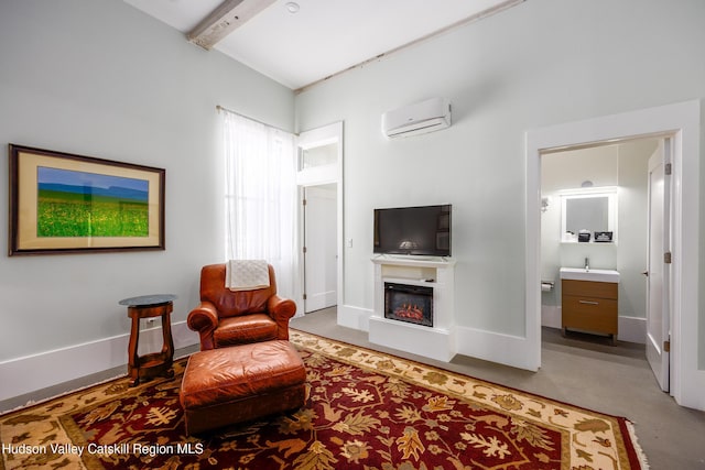 81 N Main St, Ellenville, NY 12428 - sitting room featuring a wall mounted air conditioner, beamed ceiling, baseboards, and a glass covered fireplace