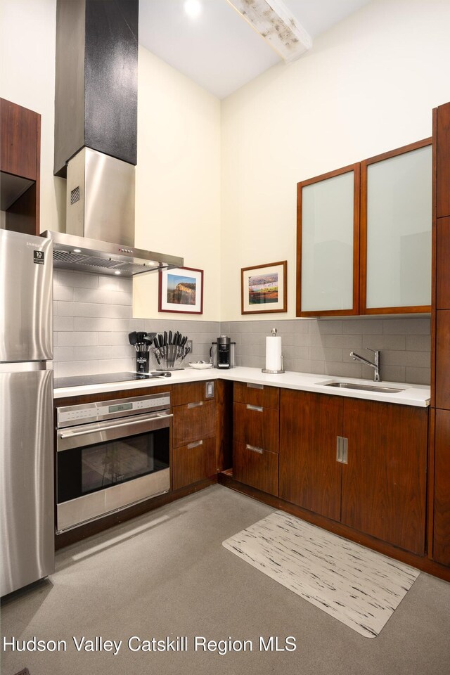 81 N Main St, Ellenville, NY 12428 - kitchen with tasteful backsplash, glass insert cabinets, light countertops, stainless steel appliances, and a sink