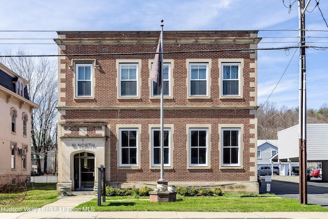 81 N Main St, Ellenville, NY 12428 - multi unit property with brick siding and a front lawn