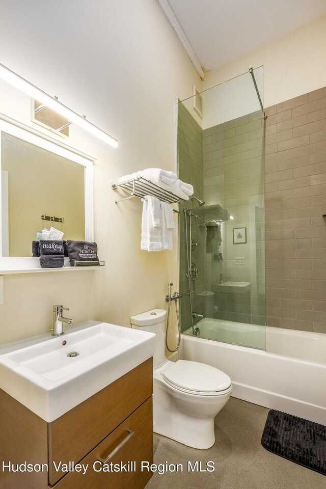 81 N Main St, Ellenville, NY 12428 - bathroom with ornamental molding, toilet, vanity, and washtub / shower combination