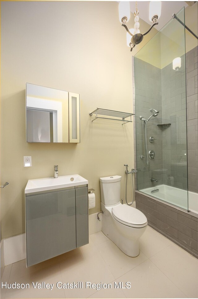 81 N Main St, Ellenville, NY 12428 - bathroom with tile patterned flooring, a chandelier, toilet, tiled shower / bath combo, and vanity