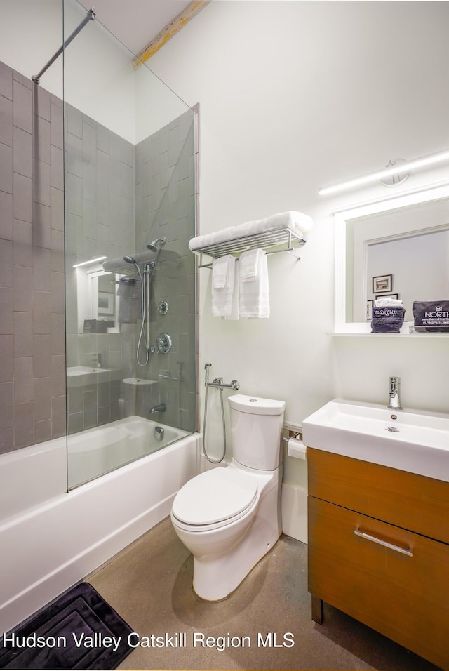 81 N Main St, Ellenville, NY 12428 - bathroom featuring speckled floor, vanity, toilet, and washtub / shower combination