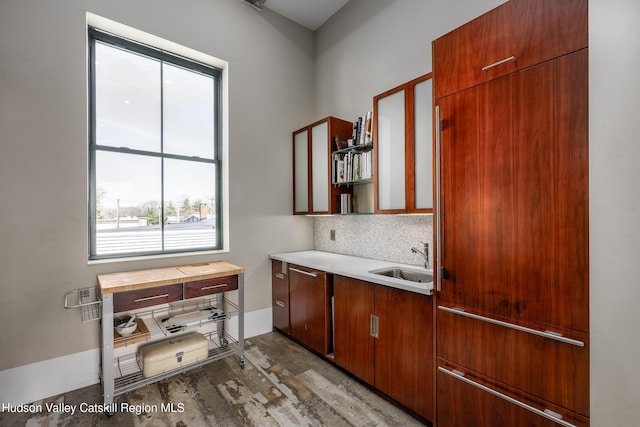 81 N Main St, Ellenville, NY 12428 - kitchen featuring tasteful backsplash, light countertops, and a sink