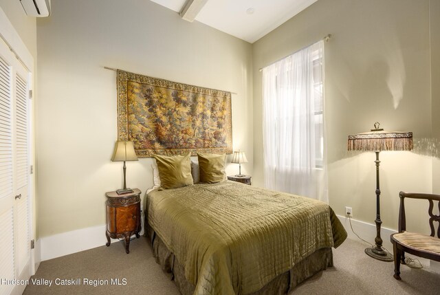 81 N Main St, Ellenville, NY 12428 - carpeted bedroom with baseboards and a wall mounted air conditioner