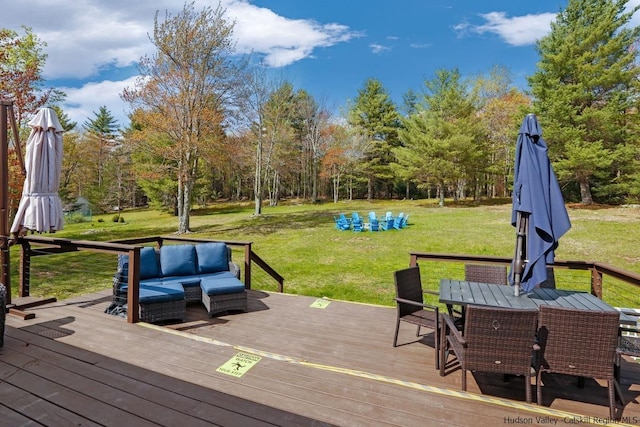 wooden deck with outdoor lounge area and a lawn