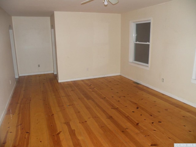 618 Bean River Rd, Pine Plains, NY 12567 - unfurnished room with arched walkways, light wood-style floors, a ceiling fan, and baseboards