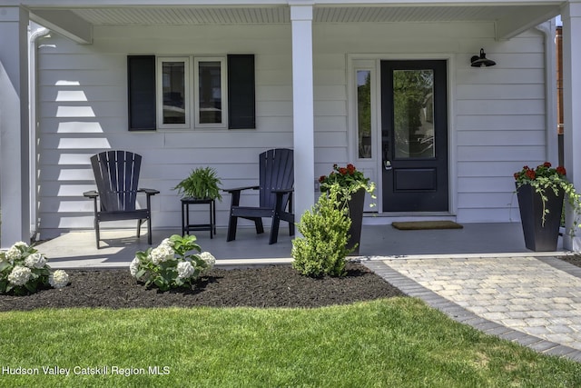 doorway to property with a porch