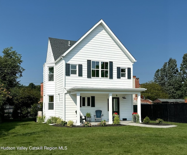 exterior space featuring a front lawn and a porch