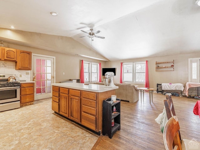 1769 Rte 51, Hannacroix, NY 12087 - kitchen with gas stove, open floor plan, light countertops, vaulted ceiling, and healthy amount of natural light