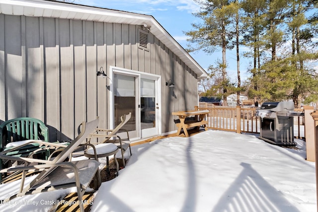 wooden terrace featuring a grill