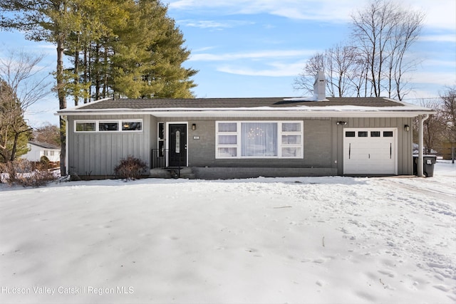 view of front of home featuring an attached garage and board and batten siding