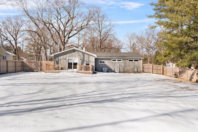exterior space with board and batten siding and a fenced backyard