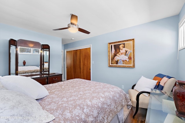 bedroom featuring a closet, a ceiling fan, and wood finished floors