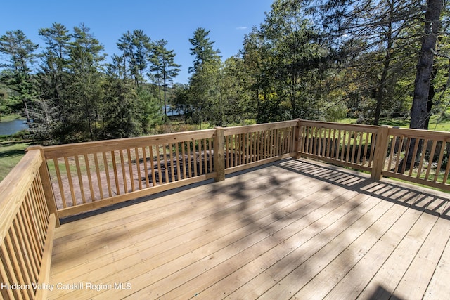 wooden terrace with a water view