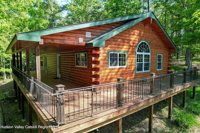 rear view of property with a deck