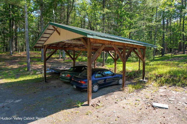 view of vehicle parking with a carport