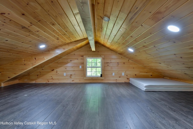 bonus room featuring wooden walls, vaulted ceiling with beams, dark hardwood / wood-style floors, and wooden ceiling