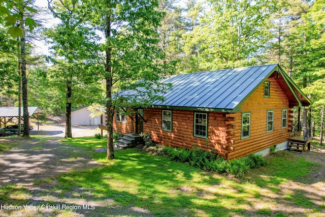 view of property exterior with a yard