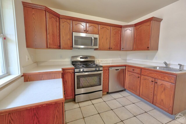 15023 Rte 23 Unit 5, Prattsville, NY 12468 - kitchen with appliances with stainless steel finishes, a sink, brown cabinets, and light countertops