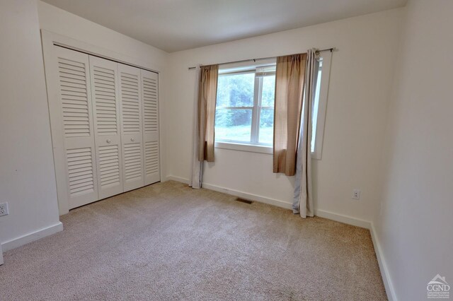 15023 Rte 23 Unit 5, Prattsville, NY 12468 - unfurnished bedroom featuring carpet, a closet, and baseboards