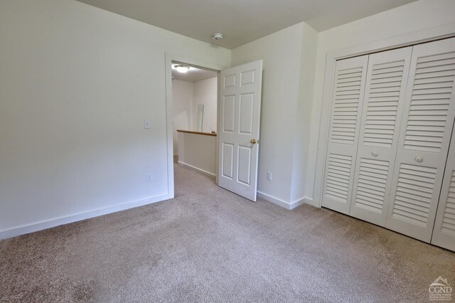 15023 Rte 23 Unit 5, Prattsville, NY 12468 - unfurnished bedroom featuring carpet, a closet, and baseboards