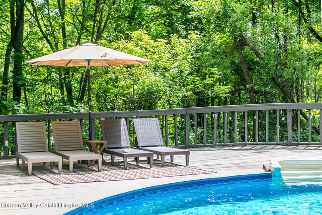 87 Boice Mill Rd, Kerhonkson, NY 12446 - outdoor pool featuring a wooden deck and a view of trees