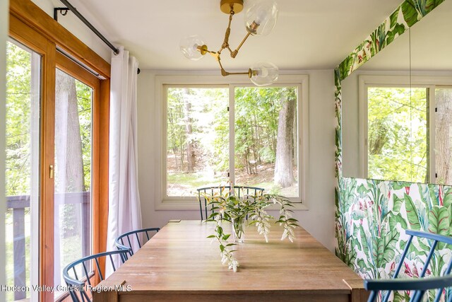 87 Boice Mill Rd, Kerhonkson, NY 12446 - dining area featuring healthy amount of natural light and a chandelier