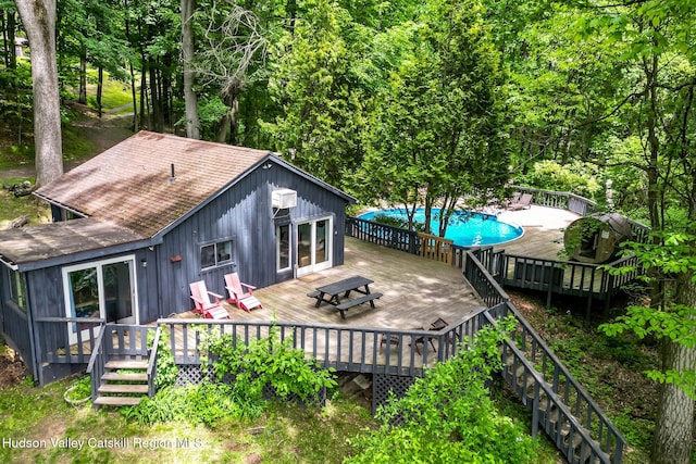 87 Boice Mill Rd, Kerhonkson, NY 12446 - back of house featuring an outdoor pool, a wooden deck, and a shingled roof