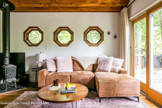 87 Boice Mill Rd, Kerhonkson, NY 12446 - living room with wood finished floors, a wood stove, and wooden ceiling