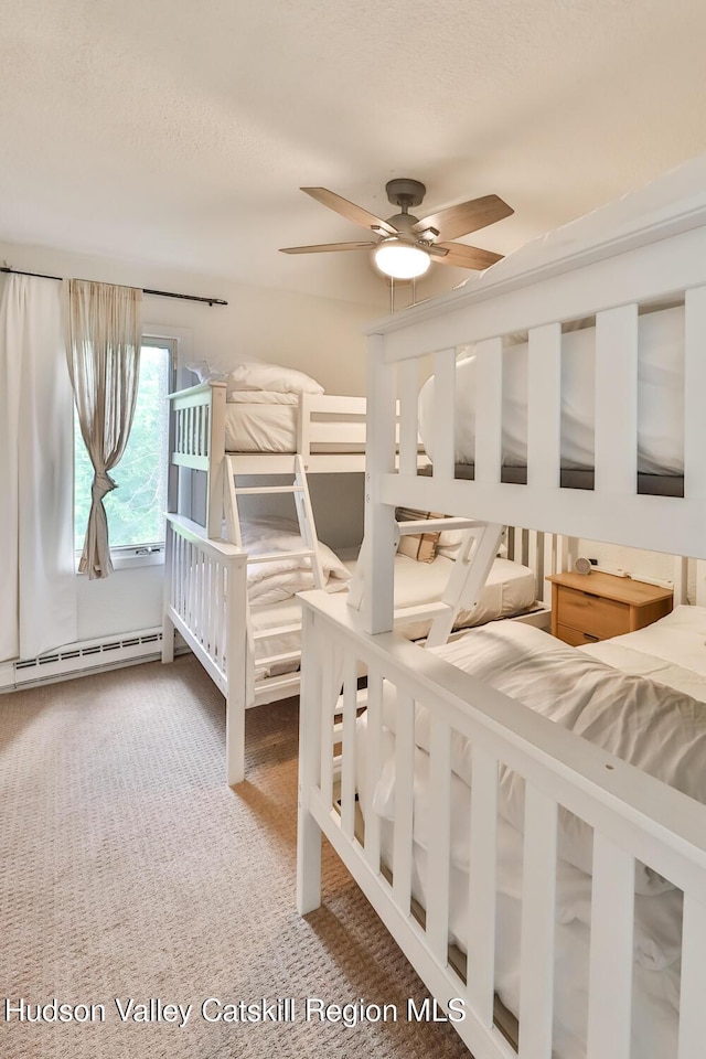 61 Scribner Hollow Rd Unit B 1, Hunter, NY 12442 - carpeted bedroom with a baseboard radiator and ceiling fan