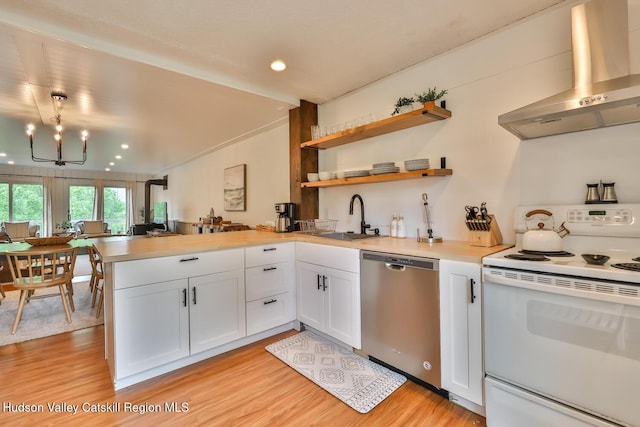61 Scribner Hollow Rd Unit B 1, Hunter, NY 12442 - kitchen featuring white range with electric stovetop, dishwasher, wall chimney exhaust hood, a peninsula, and light wood-style flooring