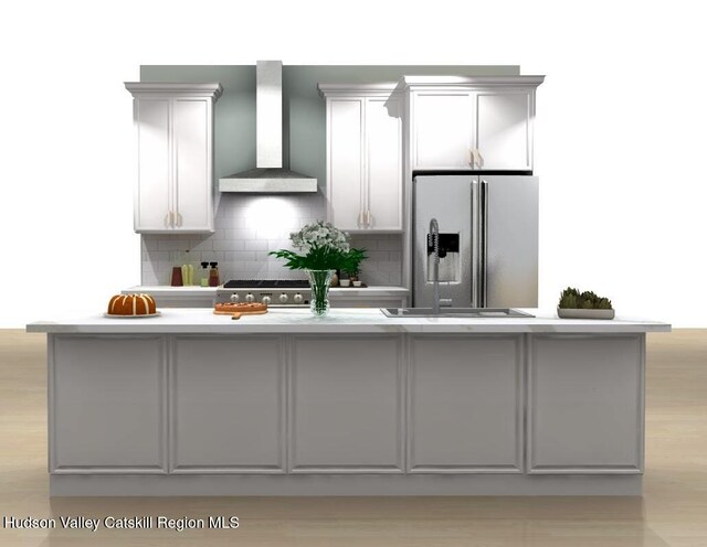 kitchen with backsplash, wall chimney range hood, gray cabinets, light hardwood / wood-style floors, and stainless steel fridge with ice dispenser