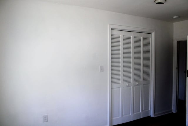 unfurnished bedroom featuring a closet